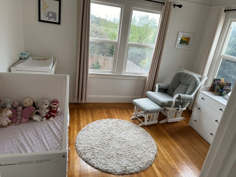 Bright nursery with vacuumed rug and dusted furniture